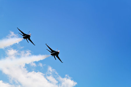 Two F16 Thunderbirds approaching Cleveland Hopkins Airport for a landing.の写真素材
