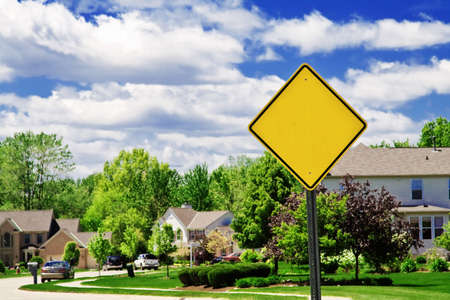 A blank sign at the entrance to a beautiful suburban neighborhood.の写真素材
