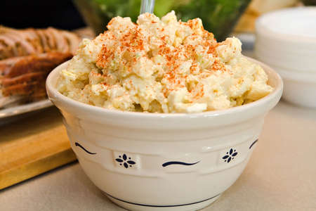 A bowl of homemade potato day - part of a summer buffet.の写真素材