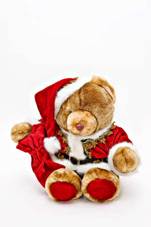 A cute Santa Teddy  Bear in red velvet suit.の写真素材