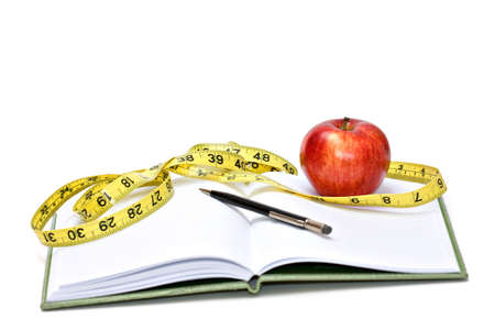 Journal, tape measure and apple - diet conceptの写真素材