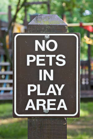 A sign indicated no pets allowed in childrens play area. の写真素材