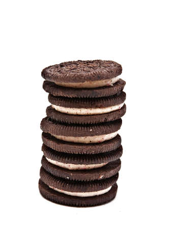 Stack of Creme filled chocolate cookies isolated on white. の写真素材