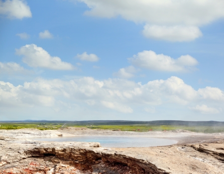 Steam rises from original Geysir  Geyser  in Icelandの写真素材