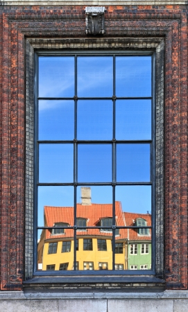 Wonderful Copenhagen with colorful buildings reflected in ornate windowの写真素材