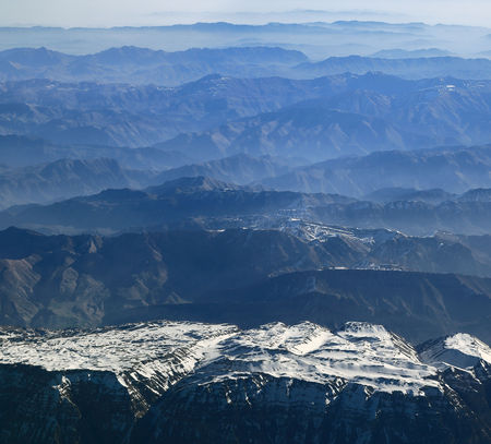 Aerial view of mountain ranges receding to the horizonの写真素材