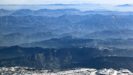 Aerial view of mountain ranges receding to the horizonの写真素材