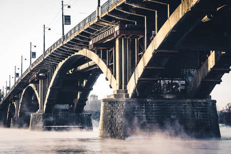 The stone bridge on the misty Riverの写真素材