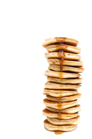 Isolated stack of pancakes dripping with maple syrup...の写真素材
