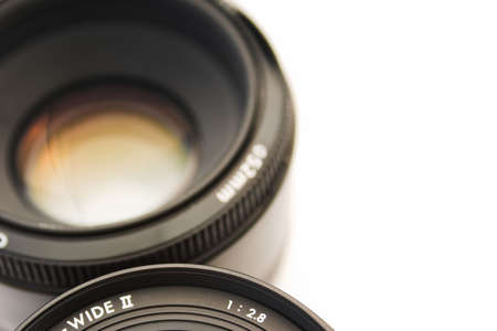 Close up of two SLR lenses - deliberate focus with intentional copy space to the rightの写真素材