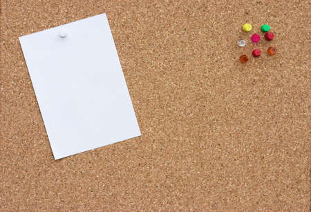 Corkboard with blank note & push pinsの写真素材