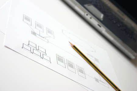 Network design diagram with laptop in background - shallow depth of fieldの写真素材