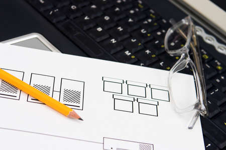 Network design draft on a laptop keyboard - shallow depth of fieldの写真素材