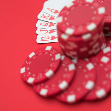 Royal flush on red with red chips - shallow depth of fieldの写真素材