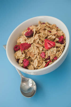 Close up of cereal & fruits on a blue background - shallow dofの写真素材