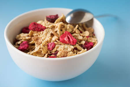 Close up of cereal & fruits on a blue  background - shallow dofの写真素材