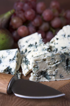 Blue cheese & grapes on a cheese board - shallow dofの写真素材
