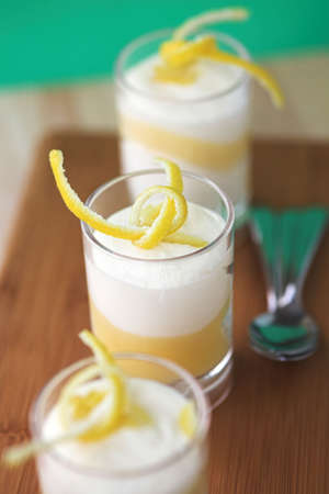 Lemon & lime tiramisu with lemon zest garnishes - shallow dofの写真素材