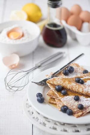 Freshly prepared crepes with blueberries - shallow dofの写真素材