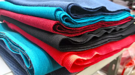 New industrial orange, black, red and blue roll background. Concept: material, fabric, manufacture,...