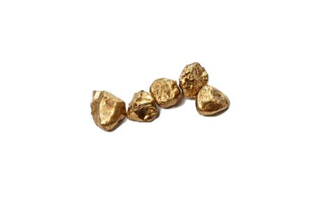 Shining gold nugget on white background.の写真素材