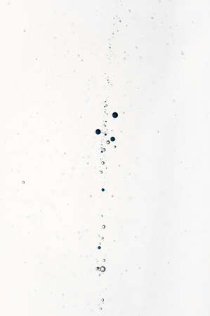 Nice blue and white air bubbles in clear waterの写真素材