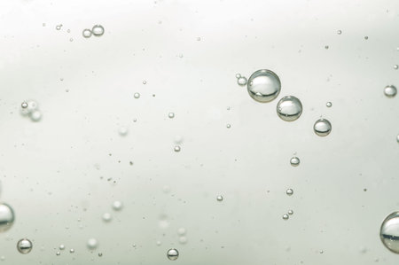 Sparkling golden and nice cool wine in a clear glassの写真素材