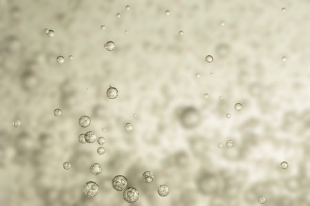 Many small bubbles in a glass of water