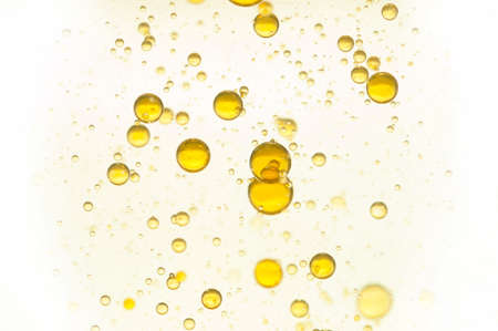 Yellow gas bubbles rising toward the surfaceの写真素材