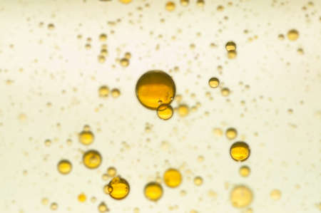 Yellow gas bubbles isolated over a blur backgroundの写真素材