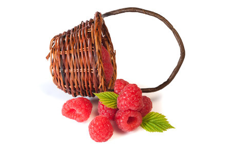 Delicious red berries collectet in a brown bamboo basket