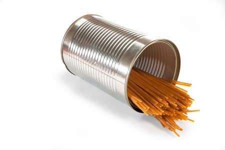 Golden Spaghetti laying in a silver tin can, isolated over a white backgroundの写真素材