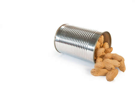 Delicious peanuts in a small tin can, isolated over a white backgroundの写真素材