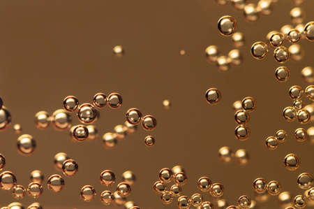 Champagne bubbles floating in a crystal glassの写真素材