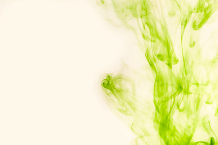 Green air dust soars over a light background