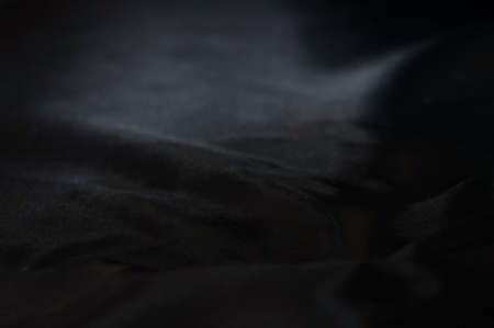 Balck silk fabric reflect the flash lightの写真素材