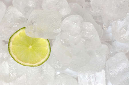 A slices of lime mixed in ice cubesの写真素材