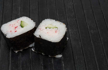 Sushi on a black wood matの写真素材