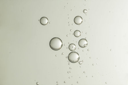Beautiful shiny air bubbles flows over a gradient background