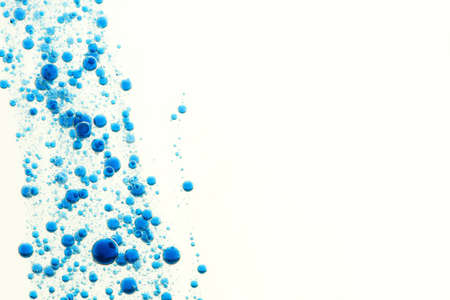 Blue water bubbles over a light backgroundの写真素材