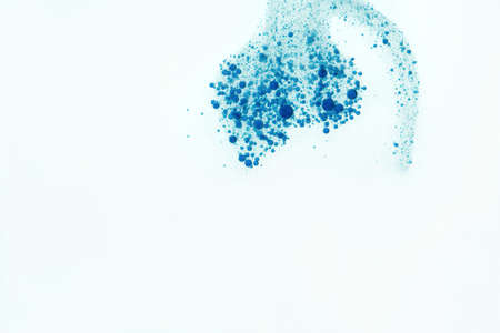 Many small blue fizz bubbles isolated over white.の写真素材
