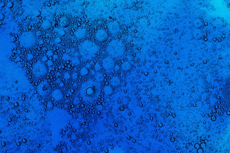 Many small dark blue bubbles forms a pattern.の写真素材