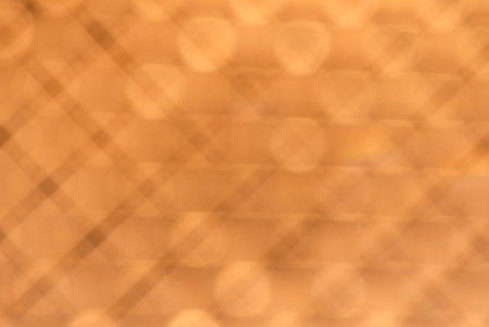 A light orange linear pattern with shiny circles.