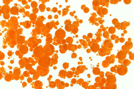 A massiv quantity of dropping orange bubblesの写真素材
