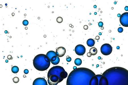 Blue and clear bubbles, mixed together, fizz, flowing.