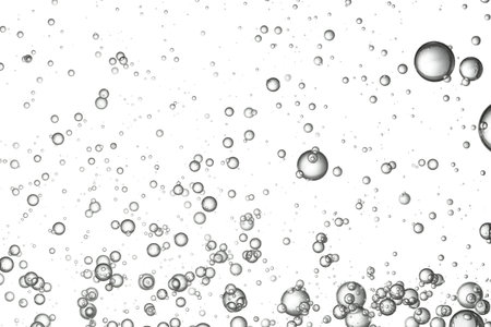 Fizz bubbles slowly rising in a glass.