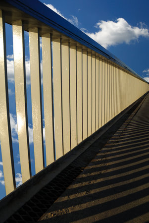 railing of brige and clouds on background