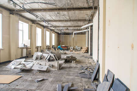 cleaning debris after repairs in the premisesの写真素材