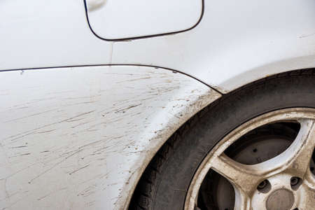 dirt and sand flies from under the rear wheel onto a painted surface and spoils the coating creating spots that are vulnerable to rustの写真素材