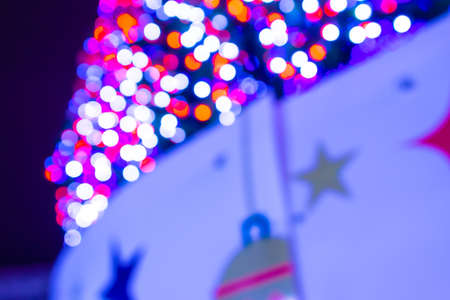 Christmas tree lights in the square, blurred unfocused backgroundの写真素材